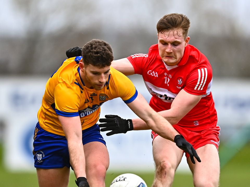 Ronan Lanigan of Clare in action against Ethan Doherty of Derry in Owenbeg, Derry. Photo: Ben McShane/Sportsfile