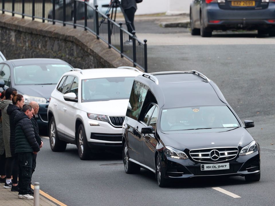 The hearse carrying the coffin of Jessica Gallagher (24) arrives at St Michael's Church, Creeslough, for her funeral mass. PA
