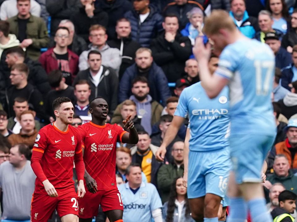 Liverpool came from behind twice to earn a point in their vital clash at Manchester City (Martin Rickett/PA)