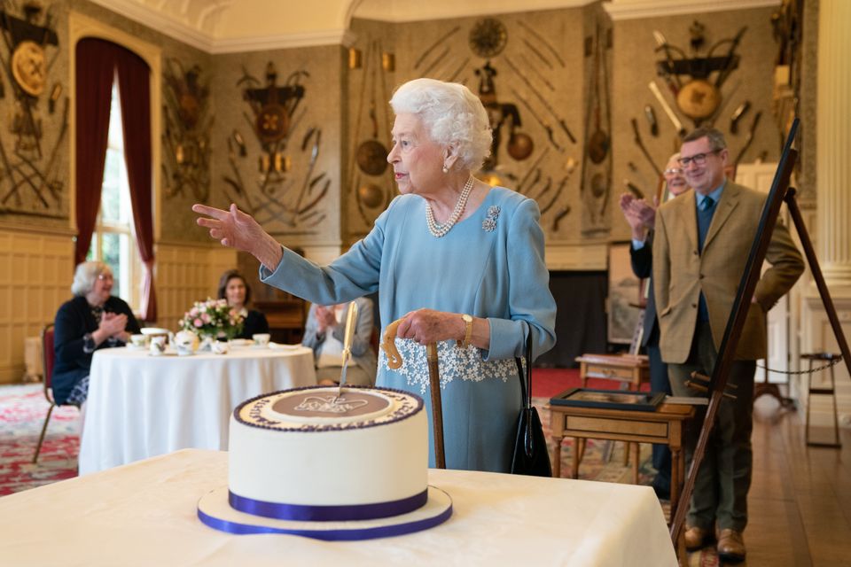 The Queen with her Jubilee cake to celebrate the start of the Platinum Jubilee (Joe Giddens/PA)