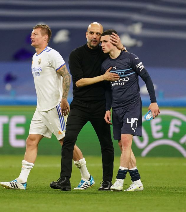 Guardiola consoles Phil Foden after City were stunned by Real Madrid’s fightback (Nick Potts/PA)