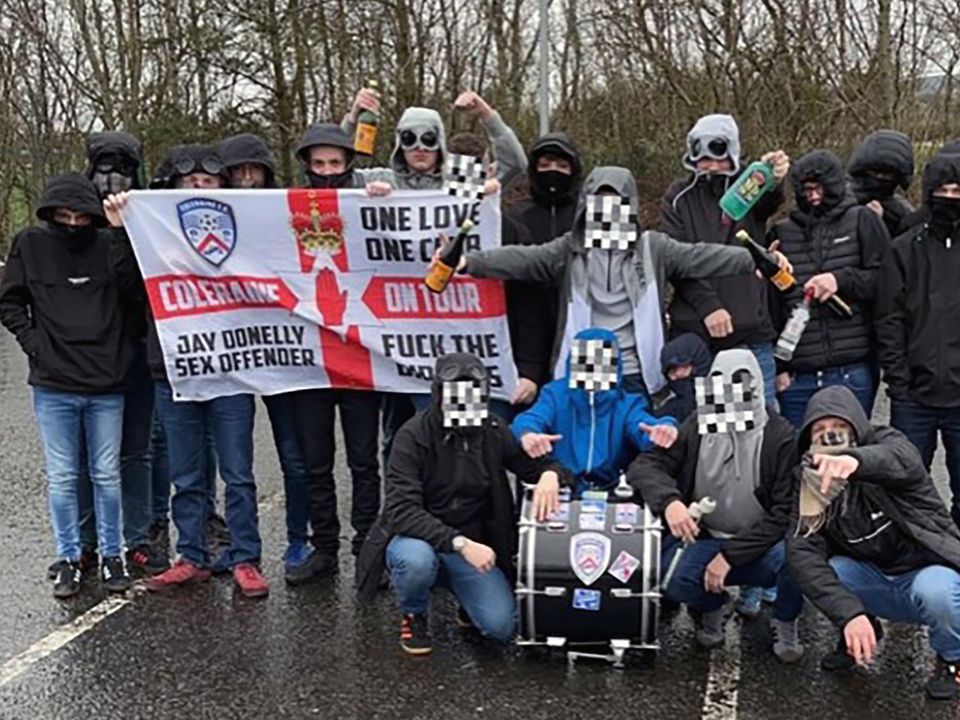 Coleraine FC fans who call themselves Ulster Ultras pose for a group photo  before making their way to Belfast, for the game against Cliftonville. 
