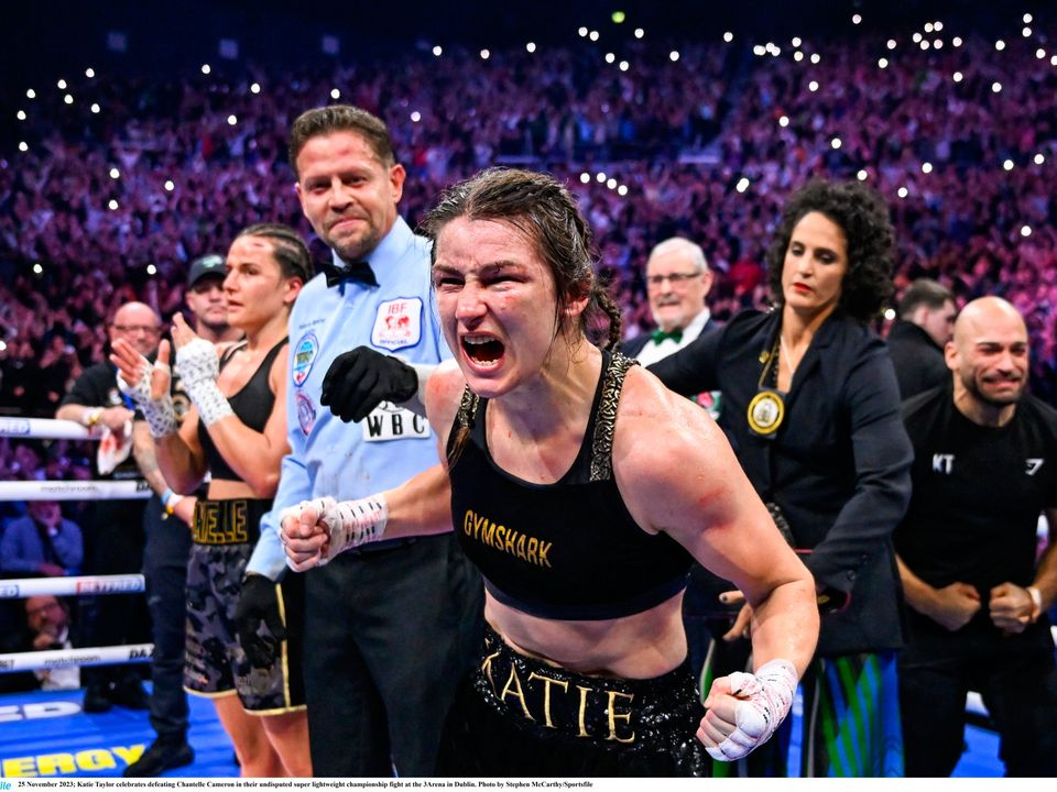 25 November 2023; Katie Taylor celebrates defeating Chantelle Cameron in their undisputed super lightweight championship fight at the 3Arena in Dublin. Photo by Stephen McCarthy/Sportsfile