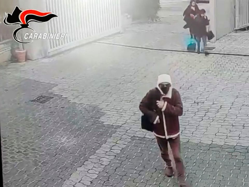 In this picture taken from a video released by Italian Carabinieri on Tuesday, Jan. 17, 2023, top Mafia boss Matteo Messina Denaro arrives for treatment at a private clinic in Palermo, Sicily, Italy. (Carabinieri via AP)