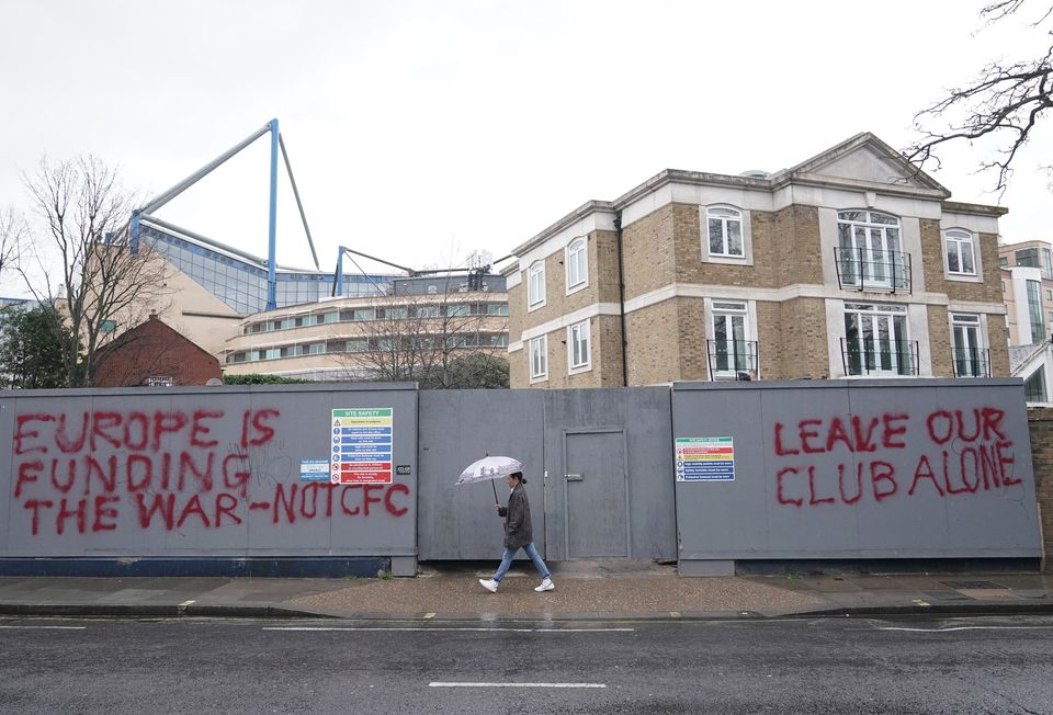 Graffiti close to Stamford Bridge shows the depth of feeling around Chelsea’s sale (Yui Mok/PA)