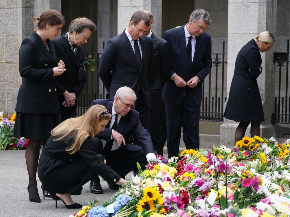 (Left-right back) Princess Eugenie, the Princess Royal, Peter Phillips, Sir Timothy Laurence, Zara Tindall (left-right front) Princess Beatrice and the Duke of York view the messages and floral tributes left by members of the public at Balmoral in Scotland following the death of Queen Elizabeth II on Thursday. Picture date: Saturday September 10, 2022.