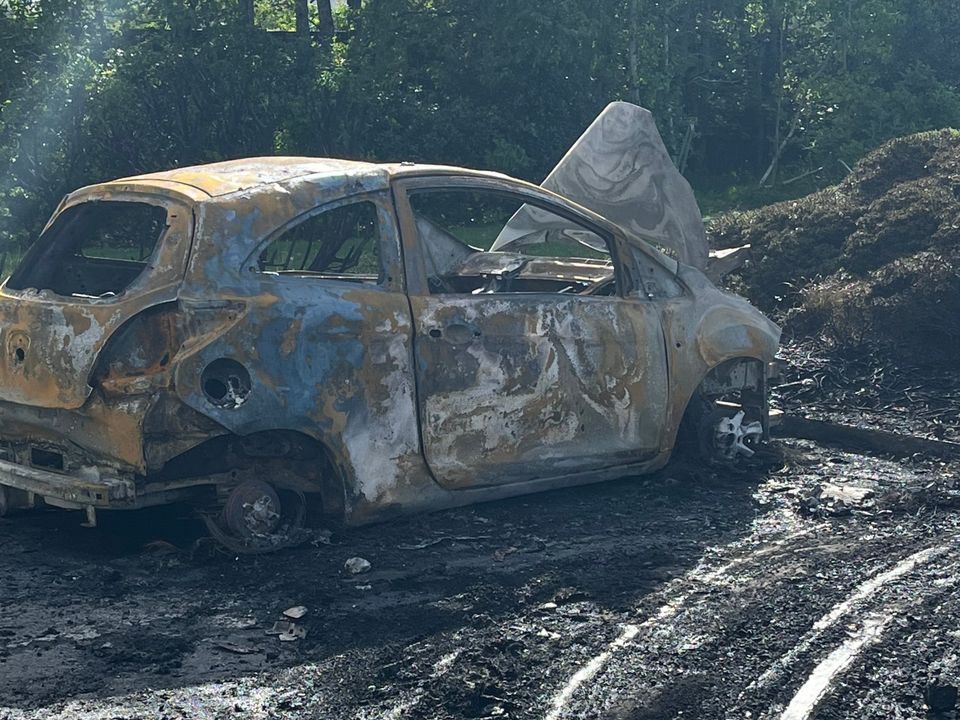 One of the burnt out cars left in the estate