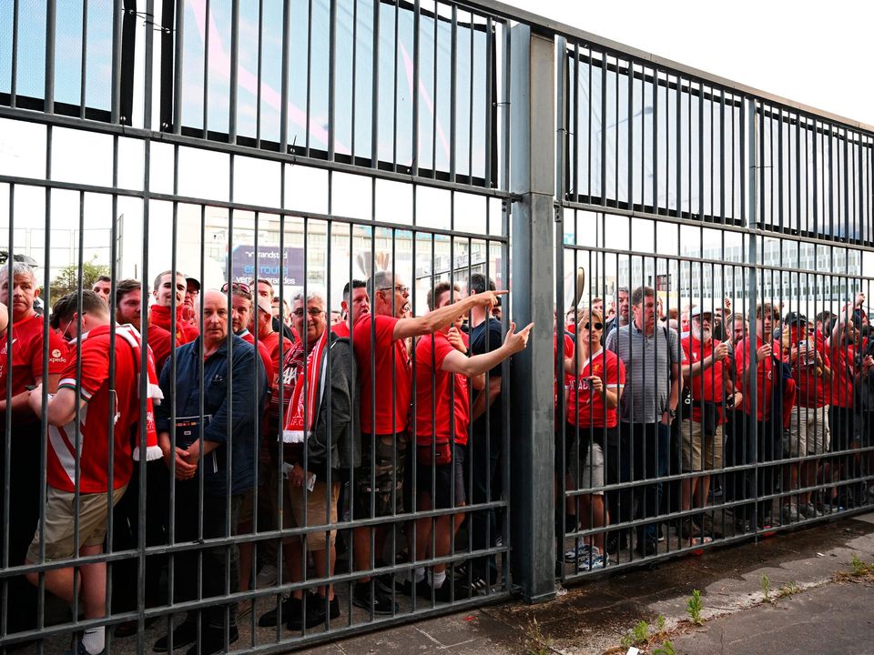 Liverpool fans are locked outside the stadium prior to the UEFA Champions League final match between Liverpool FC and Real Madrid at Stade de France on May 28, 2022 in Paris, France. (Photo by Matthias Hangst/Getty Images)