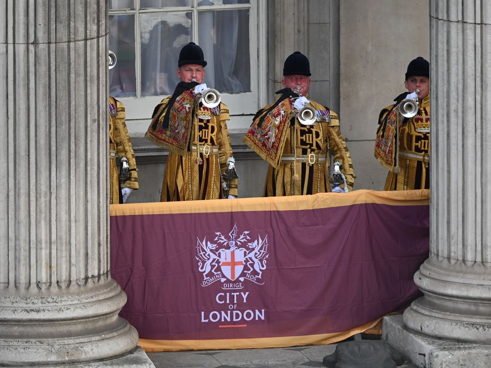 Trumpeters sound a Royal Salute during the Proclamation of Accession of King Charles III at the Royal Exchange in the City of London. Picture date: Saturday September 10, 2022.