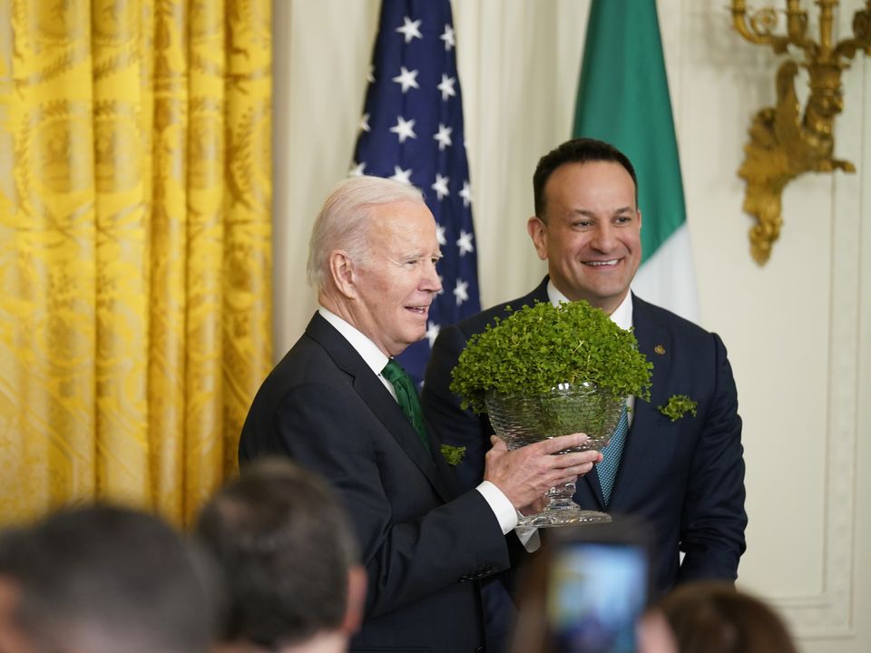 Taoiseach Leo Varadkar presents US President Joe Biden with a bowl of Shamrock (Niall Carson/PA)
