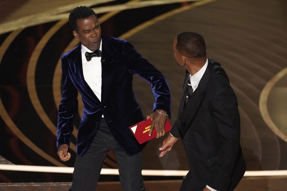 Chris Rock reacts after being hit by Will Smith (Chris Pizzello/AP)