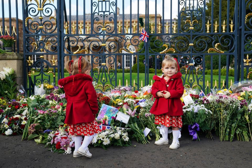 ***PARENTAL PERMISSION GIVEN**** Twins Abigail and Arabella Glen (2), from Lisburn, at the gates of Hillsborough Castle, Co. Down, following the death of Queen Elizabeth II on Thursday. 