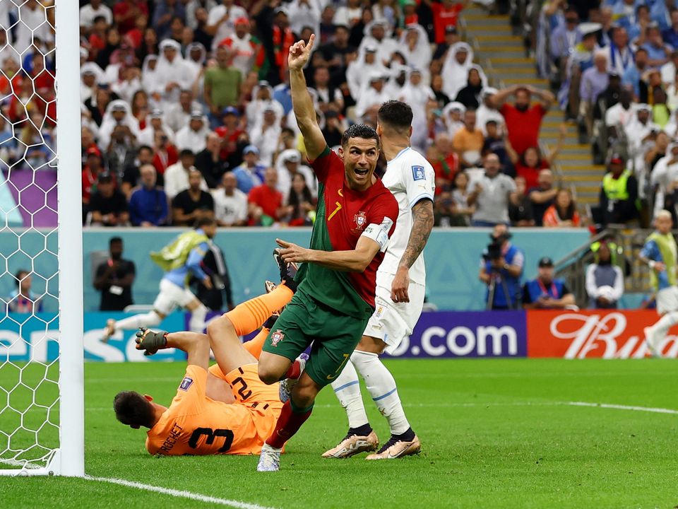 Cristiano Ronaldo of Portugal celebrates after scoring their team's first goal during the FIFA World Cup Qatar 2022 Group H match between Portugal and Uruguay at Lusail Stadium on November 28, 2022 in Lusail City, Qatar. (Photo by Justin Setterfield/Getty Images)