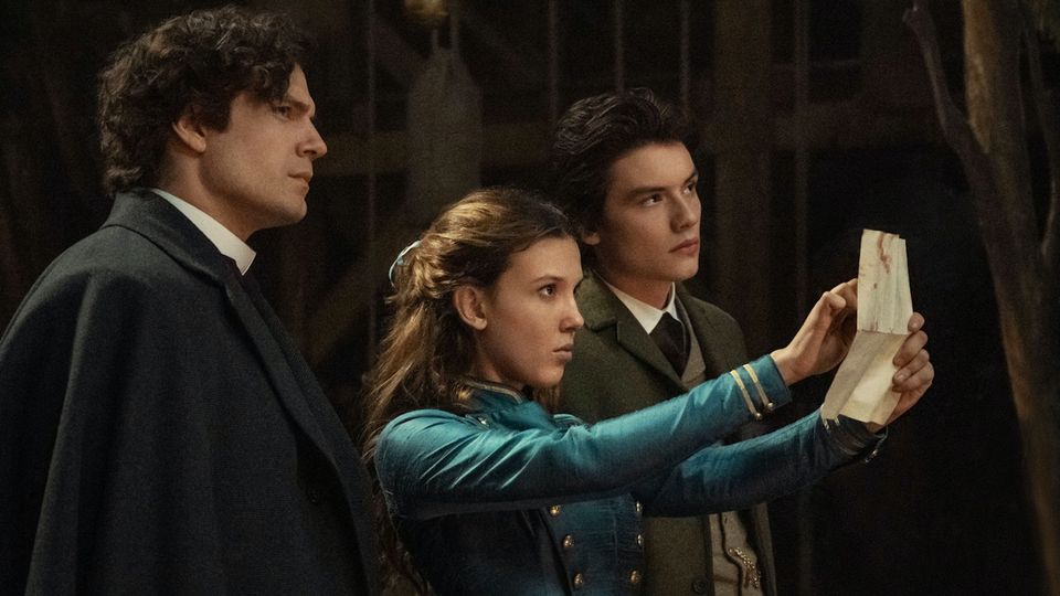 Millie with Henry Cavill and Louis Partridge in Enola Holmes 2