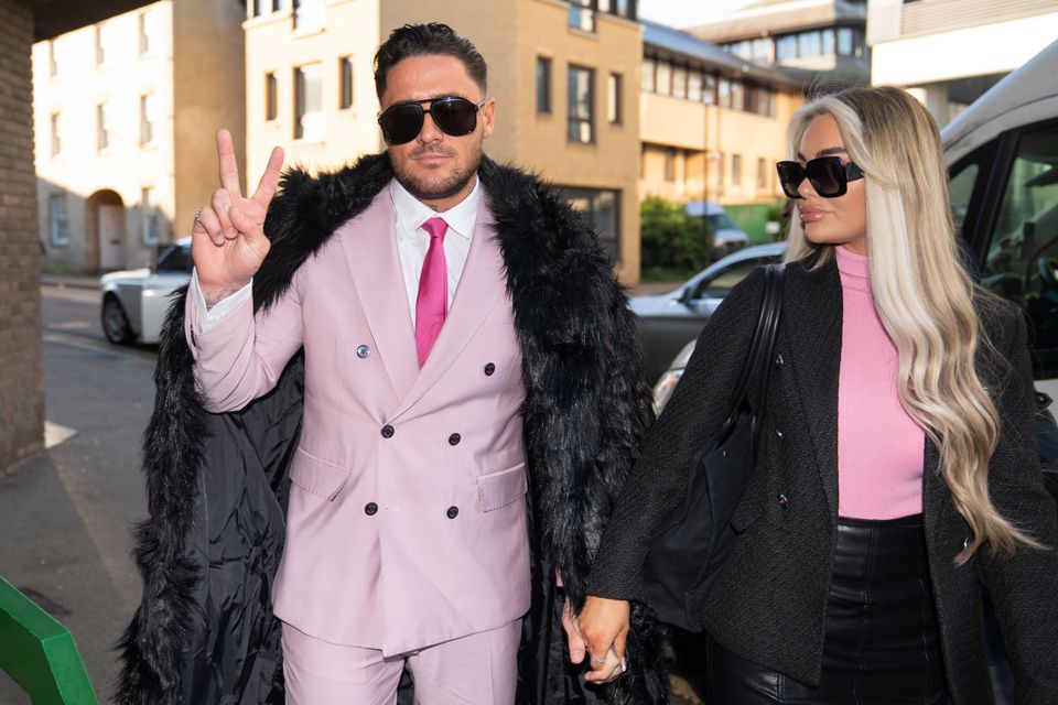 Reality TV star Stephen Bear with his partner Jessica Smith arriving at Chelmsford Crown Court, Essex, where he is charged with voyeurism and two counts of disclosing private sexual photographs or films. The 32-year-old, who appeared in Ex On The Beach, is accused of secretly recording himself having sex with a woman and posting the footage online. Picture date: Tuesday December 6, 2022.