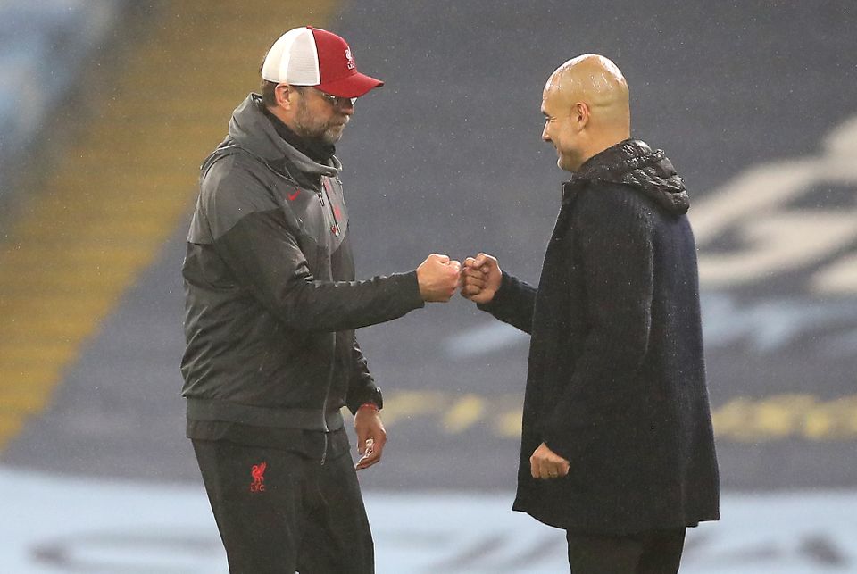 Liverpool manager Jurgen Klopp (left) and Manchester City boss Pep Guardiola will go head-to-head this weekend (Martin Rickett/PA)