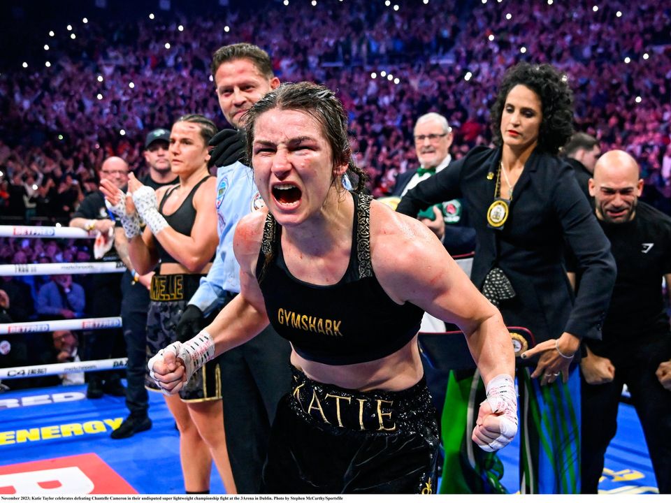 25 November 2023; Katie Taylor celebrates defeating Chantelle Cameron in their undisputed super lightweight championship fight at the 3Arena in Dublin. Photo by Stephen McCarthy/Sportsfile