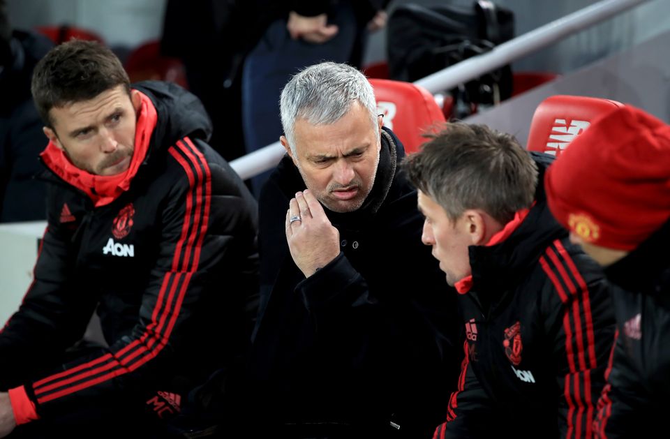 Jose Mourinho, centre, during his final game in charge against Liverpool (Peter Byrne/PA)
