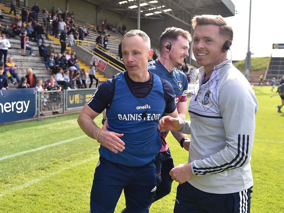 Westmeath manager Joe Fortune (left) and selector Paul O'Donoghue celebrate after the victory over Wexford. Photo: Daire Brennan/Sportsfile