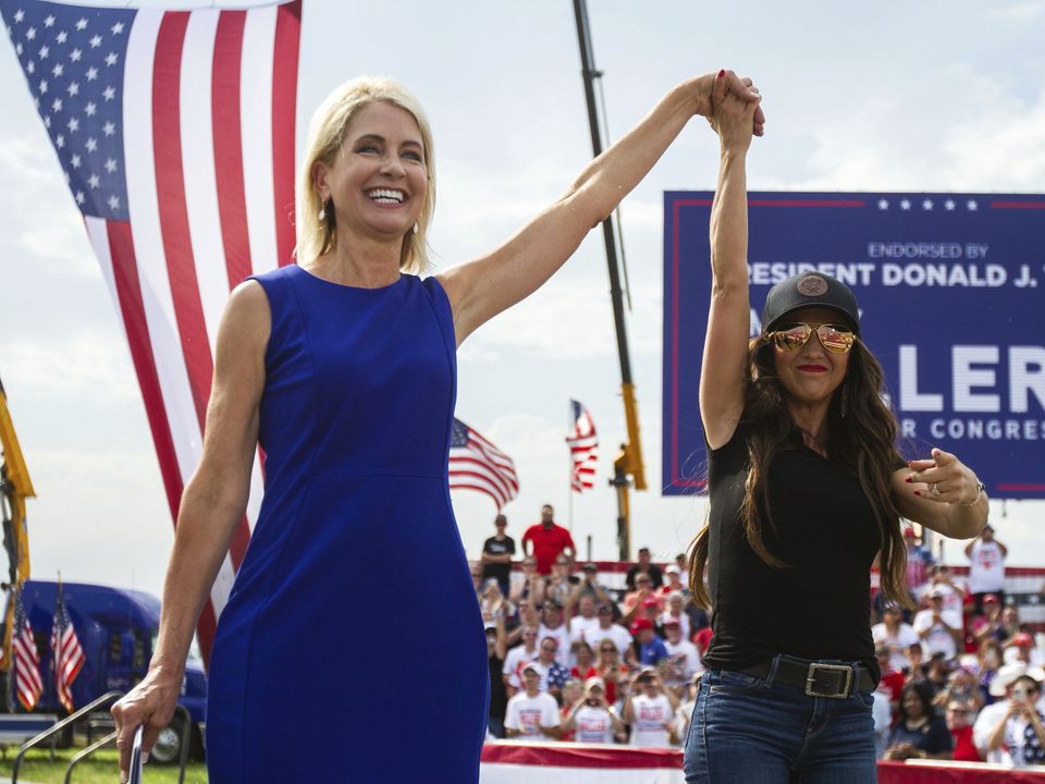 Congresswoman Mary Miller (left) is joined by US representative Lauren Boebert (right), of Colorado, on stage at a rally in Mendon, Illinois, on Saturday (Mike Sorensen/Quincy Herald-Whig/AP)