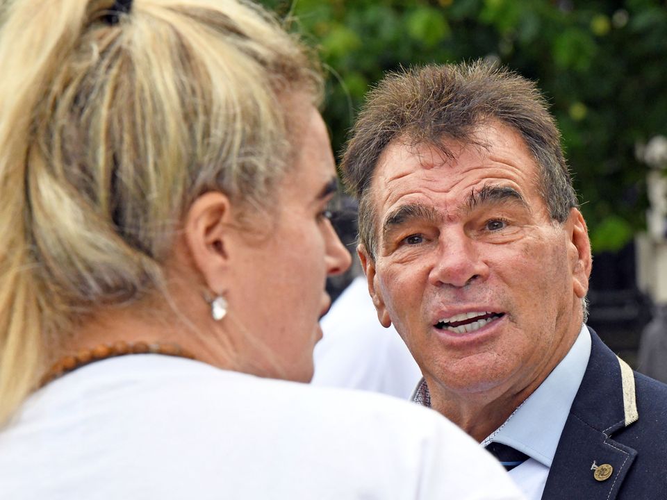 Paddy Doherty speaks to Joe Joyce’s wife Alice at the show of support outside Belfast Crown Court. Pic: Alan Lewis