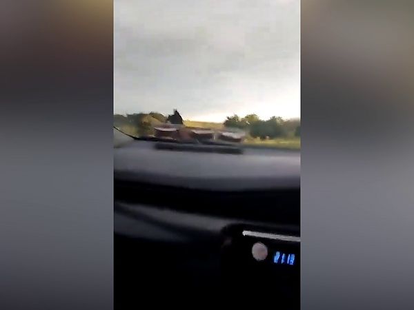 Gardai probe video showing thug drive car at ‘migrants’ as they flee through field