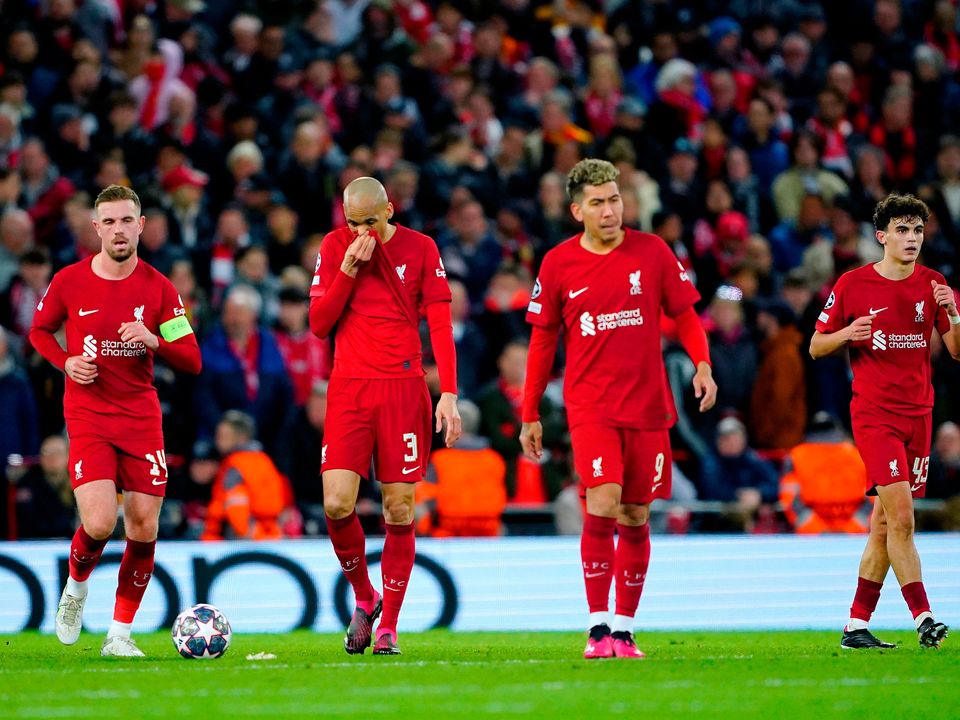 Liverpool players appear dejected during the Champions League round-of-16 match at Anfield against Real Madrid: Photo: Peter Byrne/PA Wire.