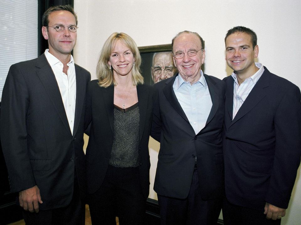 Rupert pictured with his three children, who all work in his media empire
