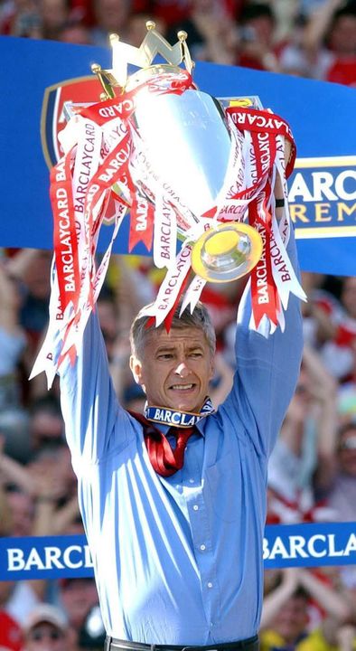 Arsene Wenger held aloft the Premier League trophy after Arsenal’s unbeaten season (Sean Dempsey/PA)