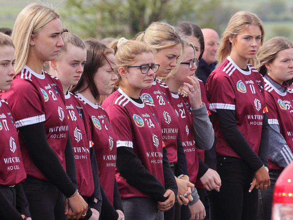 Athenry camogie team mates look on as The hearse carring the remains of Kate Moran arrives at the Church of The Sacred Heart in Ryhill, Monivea, Co Galway.Picture redit:Frank McGrath
