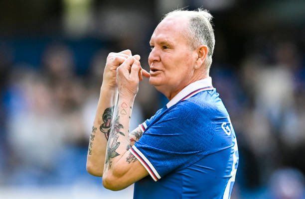 Paul Gascoigne plays an imaginary flute at Ibrox yesterday