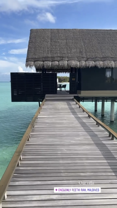 The couple are staying at a luxury water villa