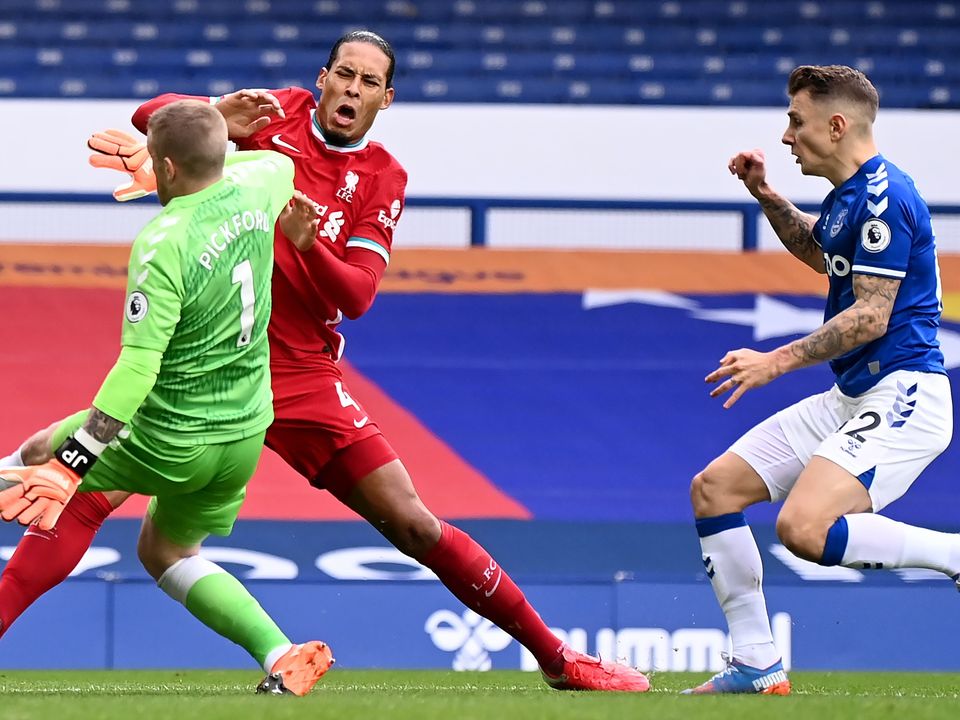Liverpool defender Virgil Van Dijk will see a consultant on Sunday with the club concerned about a knee injury sustained in the Merseyside derby (Laurence Griffiths/PA)