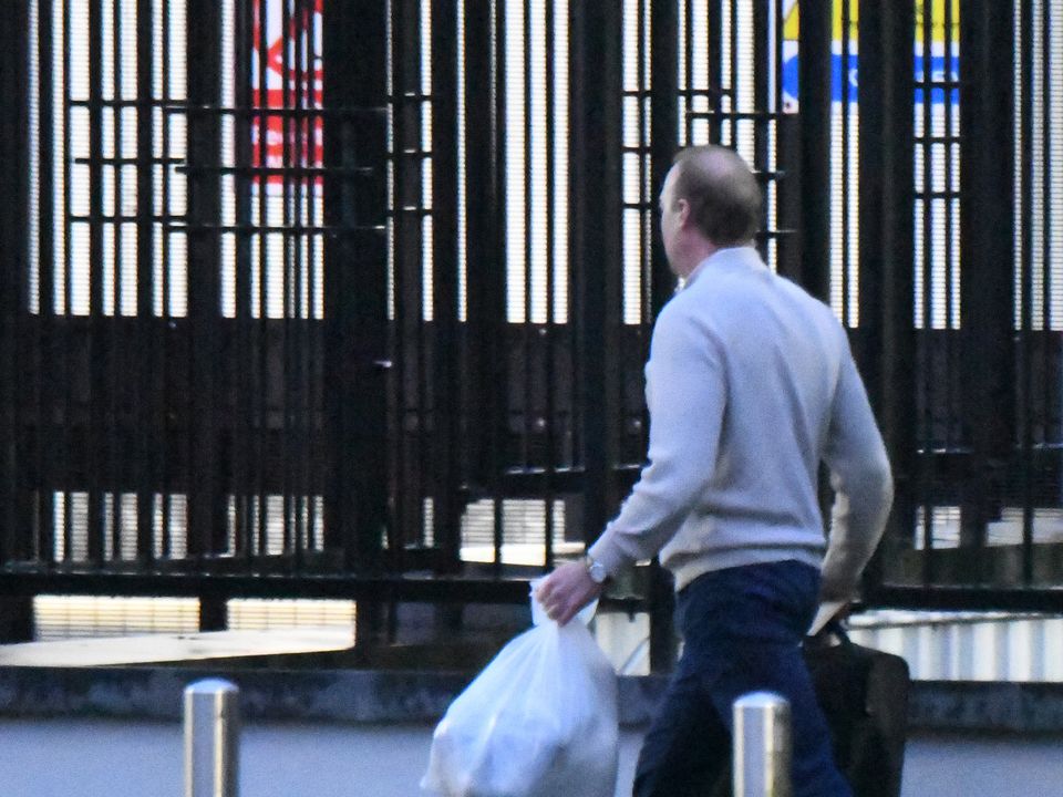 Mansfield was seen carrying two plastic bags as he walked from the prison