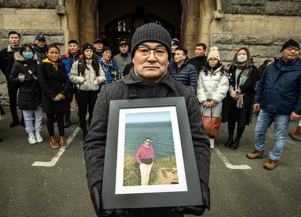 Ulambayar Surenkhor, widower of Urantsetseg Tserendorj holding a picture of his wife at her remembrance Mass in St Kevin’s Church on Harrington Street, Dublin.