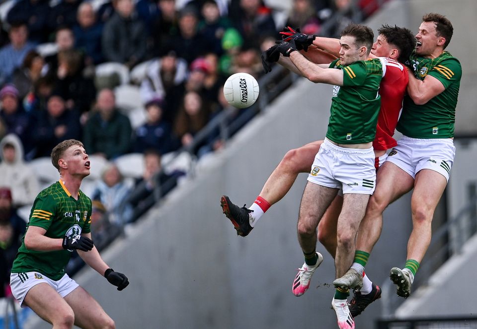 Colm O'Callaghan of Cork in action against Meath players Ronan Jones, right, and Cathal Hickey. Photo: Piaras Ó Mídheach/Sportsfile