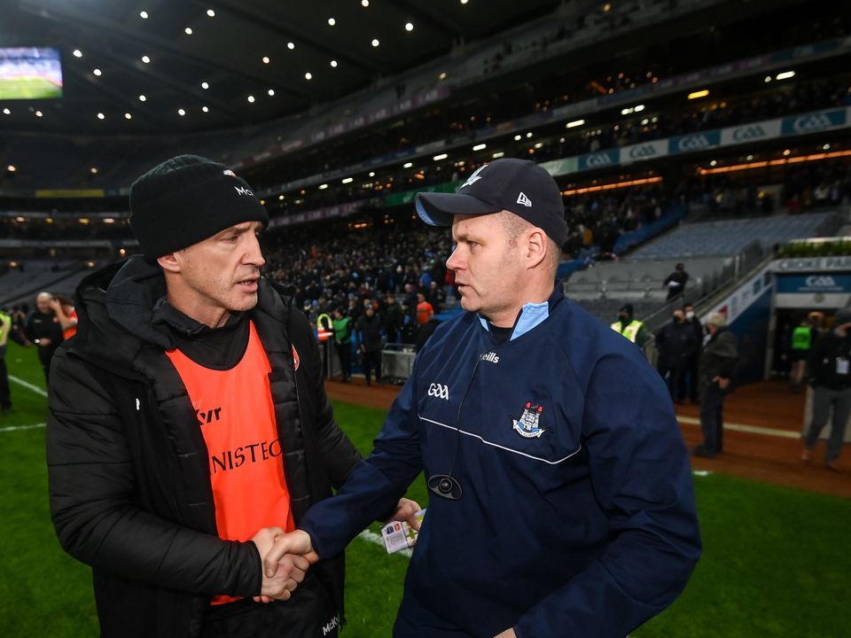 Armagh manager Kieran McGeeney, left, and Dublin manager Dessie Farrell shake hands at Croke Park. Photo by Stephen McCarthy/Sportsfile