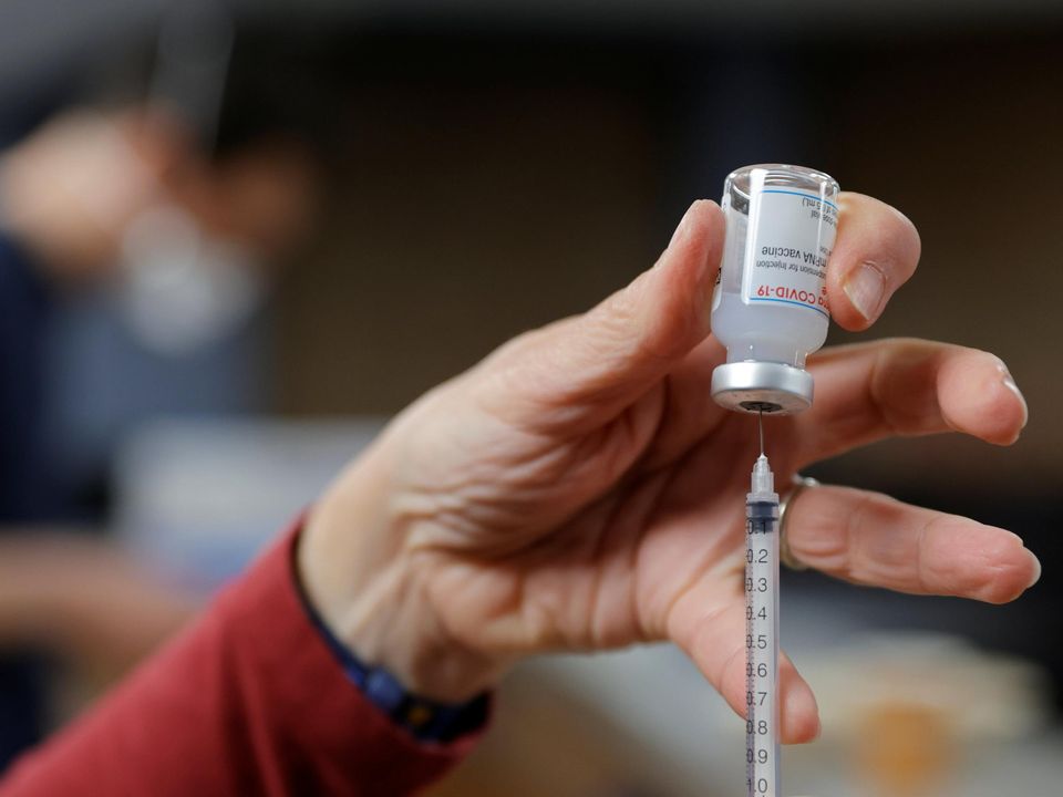 A healthcare worker prepares a Covid vaccine. Photo: Stock image