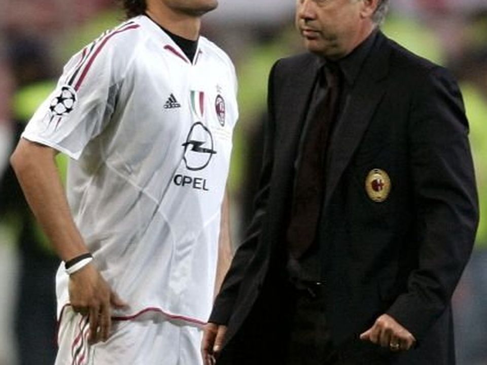 AC Milan's captain Maldini walks dejected beside manager Ancelotti after his team lost Champions League finals in Istanbul