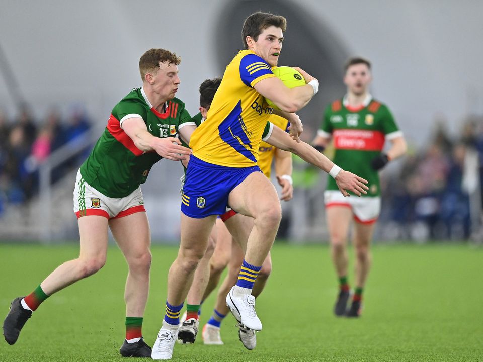 Keith Doyle of Roscommon in action against Aiden Orme, left, and Jack Coyne of Mayo. Photo: Piaras Ó Mídheach/Sportsfile