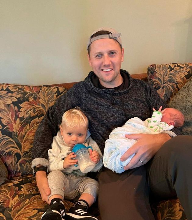 Jack relaxing with his newborn son, Thomas (right), and toddler Lucas