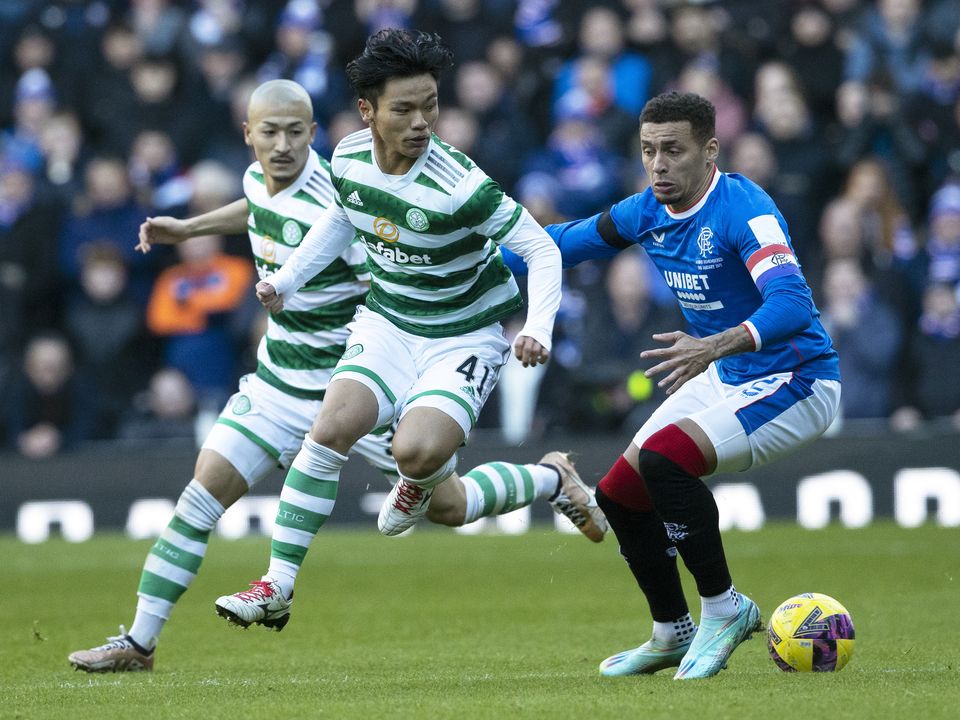GLASGOW, SCOTLAND - JANUARY 02: Rangers' James Tavernier tackles Celtic's Reo Hatate during a cinch Premiership match between Rangers and Celtic at Ibrox Stadium, on January 02, 2023, in Glasgow, Scotland.  (Photo by Alan Harvey/SNS Group via Getty Images)