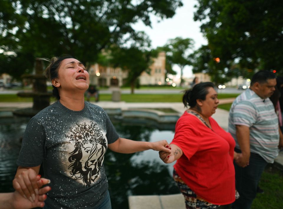 A vigil takes place for the victims (The San Antonio Express-News via AP)