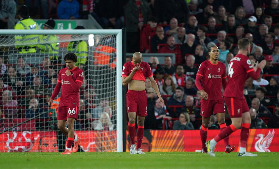 Virgil van Dijk, second right, and his Liverpool team-mates react to Tottenham’s opener (Peter Byrne/PA)