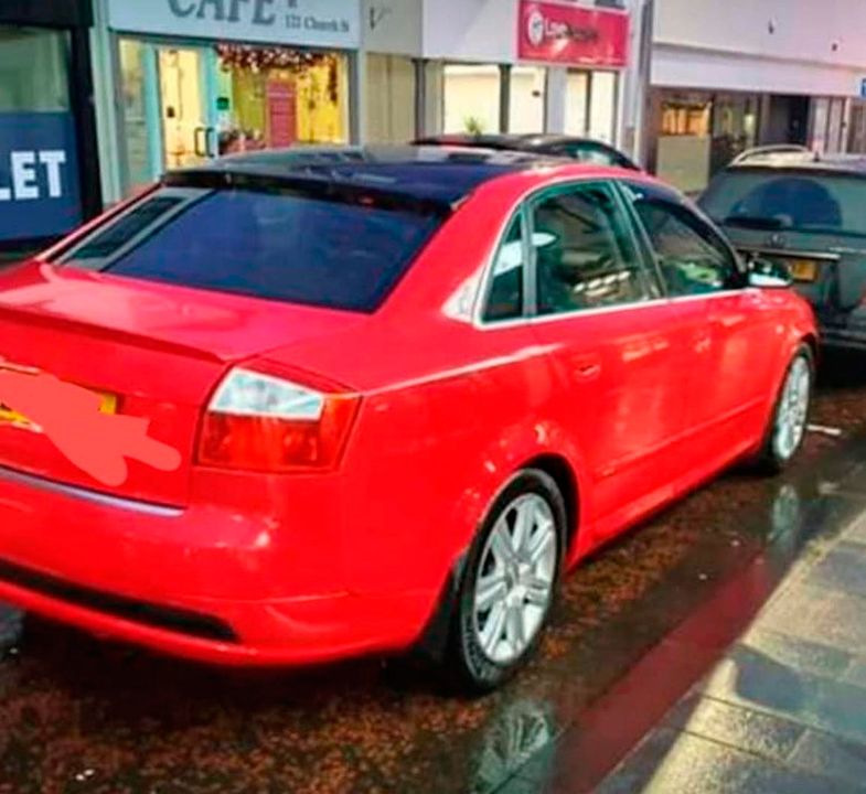 Kelly’s distinctive red Audi car