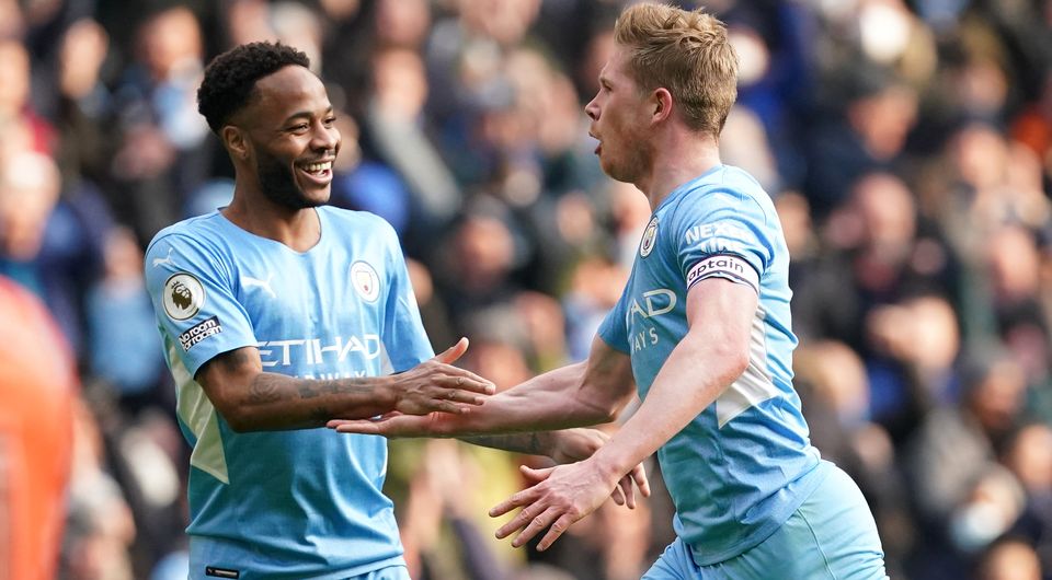 Kevin De Bruyne, right, celebrates his goal with Raheem Sterling (Martin Rickett/PA)