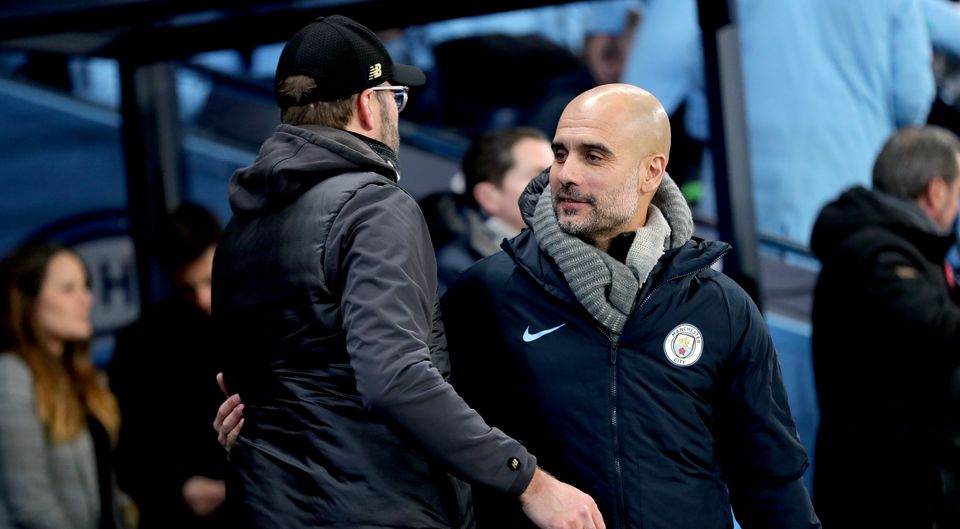 Manchester City manager Pep Guardiola, right, and Liverpool boss Jurgen Klopp are locked in a Premier League title battle (Richard Sellers/PA)