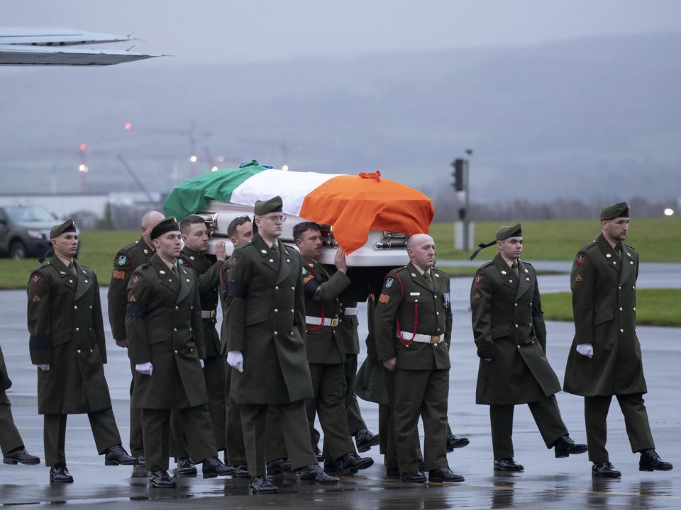 The remains of Private Seán Rooney arrive Casement Aerodrome. Photo: Colin Keegan/Collins