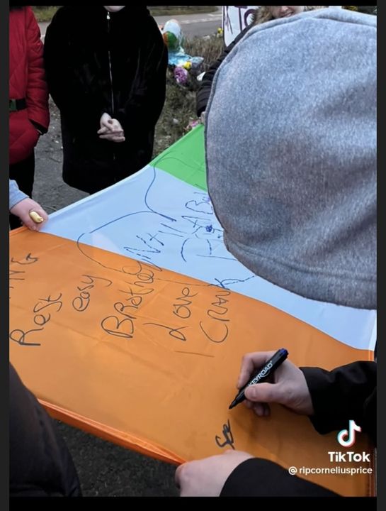 People sign the flag