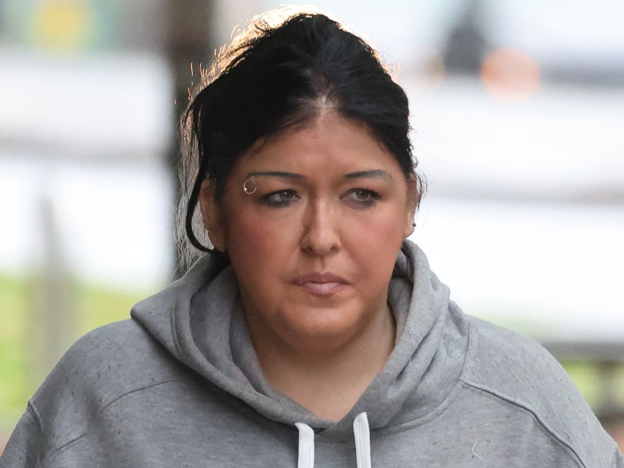 Woman who pulled clumps of hair from prison officer's head jailed for ...
